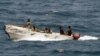 In this U.S. Navy photo, pirates leave the Ukrainian merchant vessel MV Faina for Somalia's shore Wednesday, Oct. 8, 2008 while under observation by a U.S. Navy ship. The MV Faina, which was carrying a cargo of Ukrainian T-72 tanks and related military eq