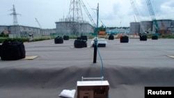 leakage detective unit (C) and its detection punch unit on an underground water storage tank are seen at Tokyo Electric Power Co. (TEPCO)'s tsunami-crippled Fukushima Daiichi Nuclear Power Plant in Fukushima, April 6, 2013.