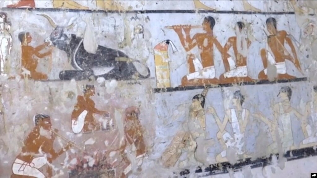 This image taken from video, Feb. 3,                  2018, shows wall paintings inside a 4,400-year-old tomb                  near the pyramids outside Cairo, Egypt. Egypt's                  Antiquities Ministry announced the discovery Saturday                  and said the tomb likely belonged to a high-ranking                  official known as Hetpet during the 5th Dynasty of                  ancient Egypt. The tomb includes wall paintings                  depicting Hetpet observing different hunting and fishing                  scenes. 