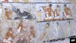 This image taken from video, Feb. 3, 2018, shows wall paintings inside a 4,400-year-old tomb near the pyramids outside Cairo, Egypt. Egypt's Antiquities Ministry announced the discovery Saturday and said the tomb likely belonged to a high-ranking official known as Hetpet during the 5th Dynasty of ancient Egypt. The tomb includes wall paintings depicting Hetpet observing different hunting and fishing scenes. 