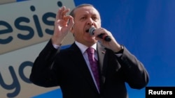 Turkey's President Recep Tayyip Erdogan speaks during the opening ceremony of school in Ankara on Nov.18, 2014.