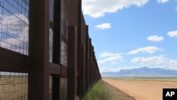 FILE - This Sept. 16, 2015 photo shows a part of the border fence near Naco, Ariz.