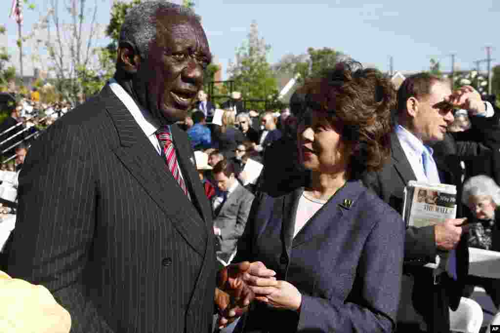 Former Ghana President John Kufuor speaks with former Labor Secretary Elaine Chao at the dedication of the George W. Bush Presidential Center, Dallas, Texas, April 25, 2013.