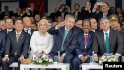 Japanese P.M. Shinzo Abe, Turkey's P.M. Tayyip Erdogan's wife, Emine Erdogan, P.M. Erdogan, President of Somalia Hassan Sheikh Mohamud, President of Turkey Abdullah Gul attend opening ceremony of Marmaray tunnel, in Istanbul, Oct. 29, 2013.