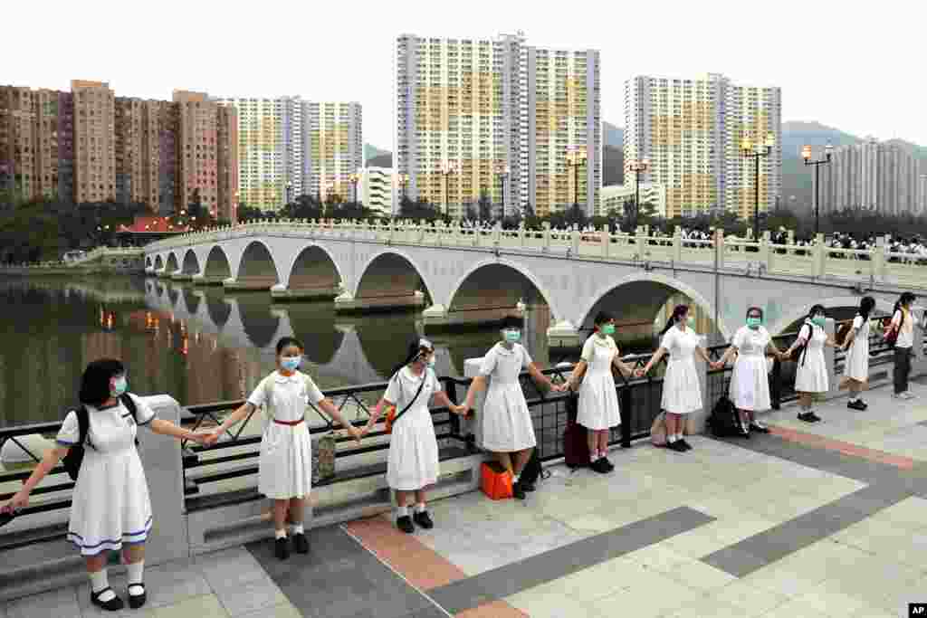 Students form a human chain during an anti-government protest in Sha Tin district in Hong Kong.