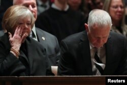 Judy and Dennis Shepard take their seats for a memorial service for the interment of the ashes of their late son Matthew Shepard.