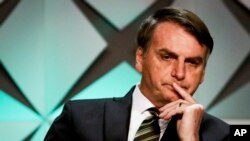 Presiden Brazil Jair Bolsonaro menghadiri pembukaan Forum Investasi Brazil 2019 di Sao Paulo, 10 Oktober 2019. (Foto: AP)