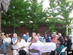 Guests gather for a meal at the home of American Muslim Voice founder Samina Sundas.