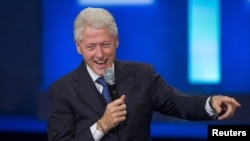 FILE - A poll indicates former U.S. President Bill Clinton could be a help to Hillary Clinton in the Democratic primary but a hindrance to her in the general election. He's shown at the Clinton Global Initiative's annual meeting in New York, Sept. 29, 2015.