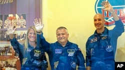 Members of the next mission to the International Space Station, from left: U.S. astronaut Karen Nyberg, Russian cosmonaut Fyodor Yurchikhin, and European Space Agency astronaut Luca Parmitano at Baikonur cosmodrome, Kazakhstan, May 27, 2013. 
