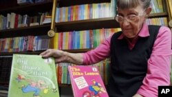 Jan Berenstain shows a copy of the first two books she and husband, Stanley Berenstain, created for children