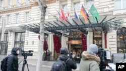 Journalists wait in front of the Grand Hotel Wien where closed-door nuclear talks with Iran take place in Vienna, Austria, Tuesday, April 6, 2021. 