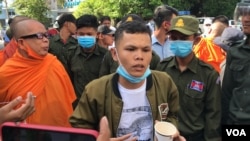 FILE - Thun Ratha, an activist of Mother Nature Cambodia, takes part in a protest at a Caltex gasoline station in Phnom Penh, Cambodia, on July 8, 2020. (Hul Reaksmey/VOA Khmer) 