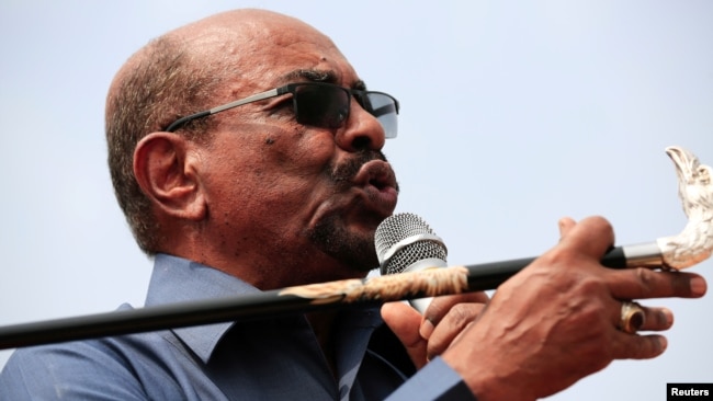 FILE - Sudan's President Omar al-Bashir addresses supporters during his visit to the war-torn Darfur region, in Bilal, Darfur, Sudan Sept. 22, 2017. 