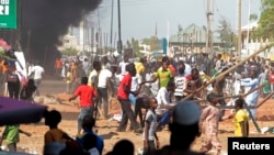 People protest against the increased violence ahead of a visit by Nigerian President Goodluck Jonathan to the state, after a suicide bomb explosion in Gombe, Feb. 1, 2015. 