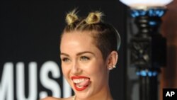 Miley Cyrus arrives at the MTV Video Music Awards on Aug. 25, 2013, at the Barclays Center in the Brooklyn borough of New York.