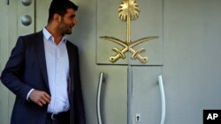 Officials leave Saudi Arabia consulate in Istanbul, Oct. 7, 2018. A friend of a Saudi journalist who went missing in Istanbul says officials told him to "make your funeral preparations." 