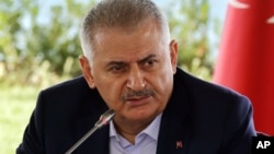 Turkish Prime Minister Binali Yildirim speaks during a meeting with foreign media representatives in Istanbul, Aug. 20, 2016.
