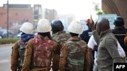 Burkina Faso's soldiers take position in the surroundings of the Splendid hotel following an attack by Al-Qaeda linked gunmen on Jan. 16, 2016 in Ouagadougou. 