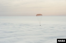 The Soyuz TMA-18M spacecraft is seen as it lands with Expedition 46 Commander Scott Kelly of NASA and Russian cosmonauts Mikhail Kornienko and Sergey Volkov of Roscosmos near the town of Zhezkazgan, Kazakhstan on Wednesday, March 2, 2016.