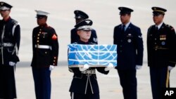A soldier carries a casket containing a remain of a U.S. soldier who was killed in the Korean War during a ceremony at Osan Air Base in Pyeongtaek, South Korea, July 27, 2018. 