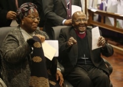 FILE - Anglican Archbishop Emeritus Desmond Tutu's and his wife Leah as Tutu celebrates four decades of episcopal ministry at a special thanksgiving Mass at St Mary's Cathedral in Johannesburg, South Africa, July 10, 2020.