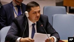 Ukraine's Deputy UN Ambassador Oleksandr Pavlichenko addresses the U.N. Security Council as they meet to discuss the humanitarian situation in Ukraine, Aug. 5, 2014.