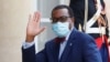 FILE - President of the African Development Bank, M. Akinwumi Adesina waves as he arrives for a dinner with French President Emmanuel Macron and leaders of African states and international organisations on the eve of a summit on aid for Africa, at Elysee 