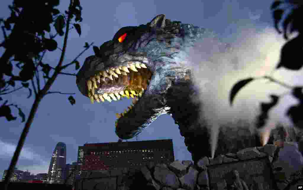 A giant Godzilla head towering 52-meters (171 feet) above ground level is unveiled in Tokyo, Japan.