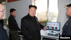 In this undated photo released by North Korea's Korean Central News Agency, North Korean leader Kim Jong Un visits the Korean April 26 Cartoon Film Studio.