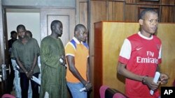 Suspected members of Boko Haram sect enter the federal High court where they are accused of plotting bombings that killed 25 people, Abuja, September 23, 2011.