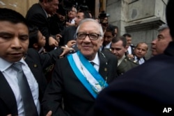 Guatemala's new President Alejandro Maldonado leaves the Congress building after his swearing-in ceremony in Guatemala City, Sept. 3, 2015.