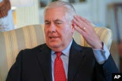 Secretary of State Rex Tillerson gestures during a interview with the Associated Press at the State Department in Washington, Jan. 5, 2018.