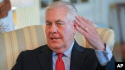 Secretary of State Rex Tillerson gestures during a interview with the Associated Press at the State Department in Washington, Jan. 5, 2018. 