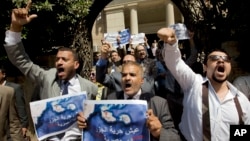 Dozens of lawyers shout slogans during a protest against the accord to hand over control of two strategic Red Sea islands, Tiran and Sanafir, to Saudi Arabia in front of the lawyers syndicate in Cairo, Egypt, June 13, 2017.