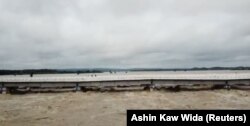 A bridge is seen after a dam breach flooded the area in Swar township, Myanmar, Aug. 29, 2018, in this still image from video obtained from social media.