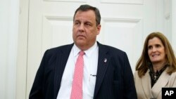 FILE- New Jersey Gov. Chris Christie, seen here with and his wife, will address the NJ Chamber of Commerce’s 80th annual trip to Washington, Feb. 16, 2017. The governor is coming under criticism after photos showed him relaxing on a public beach he closed over a budget impasse.