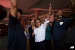 Mayor Carmen Yulin Cruz arrives at San Francisco hospital in Rio Piedras in the middle of an evacuation of about 35 patients after the failure of an electrical plant, in San Juan, Puerto Rico, Saturday, Sept. 30, 2017. (AP Photo/Carlos Giusti)