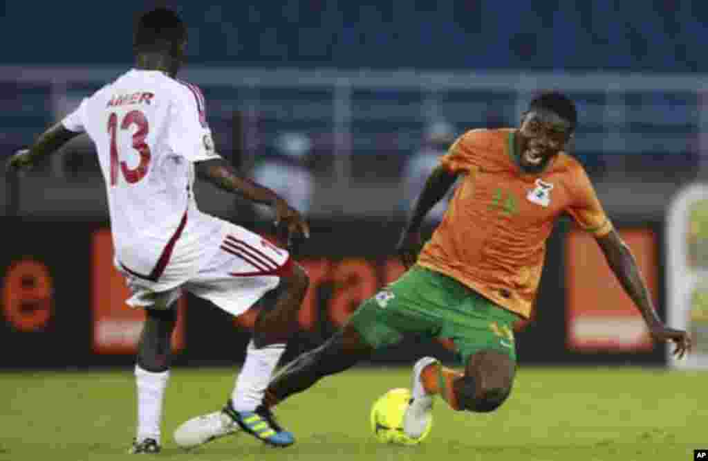 Nathan Sinkala of Zambia (R) fights for the ball with Amer Kamal of Sudan during their African Nations Cup quarter-final soccer match at Estadio de Bata "Bata Stadium", in Bata February 4, 2012.