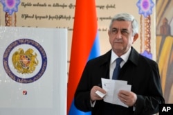 FILE - Serzh Sargsyan, Armenia's president at the time, prepares to casts his ballot at a polling station during parliamentary elections, in Yerevan, Armenia, April 2, 2017.