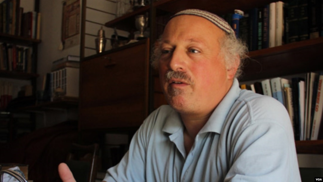 Daniel Pinner in his home in the Israeli settlement of Kfar Tapuach, July 27, 2012, says Israeli sovereignty extends from the Jordan River to the Mediterranean Sea. (VOA/Rebecca Collard).