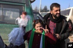 Syrians evacuated from the embattled Syrian city of Aleppo during the cease-fire arrive at a refugee camp in Rashidin, near Idlib, Syria, Dec. 20, 2016.