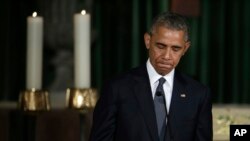 President Barack Obama pauses while delivering the eulogy in honor of former Delaware Attorney General Beau Biden at St. Anthony of Padua Church in Wilmington, Del., June 6, 2015.