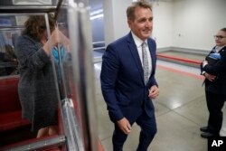 Sen. Jeff Flake, R-Ariz., a member of the Foreign Relations Committee, returns to his office after a closed-door security briefing at the Capitol in Washington, Oct. 25, 2017.