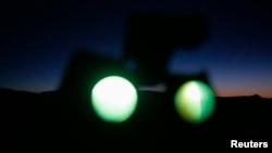 A pair of night vision goggles are seen being used outside Sedona, Arizona, Feb. 14, 2013. U.S. military night vision and thermal imaging scopes were among items Chinese national Kan Chen smuggled or tried to smuggle into China, an indictment against him says.