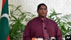 Maldives Attorney General Mohamed Anil speaks during a press conference in Male, Maldives, after President Yameen revoked a state of emergency, Tuesday, Nov. 10, 2015.