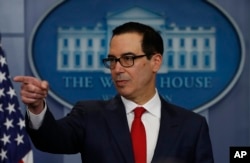 FILE - Treasury Secretary Steven Mnuchin takes a question during the news briefing at the White House, in Washington, Aug. 25, 2017.