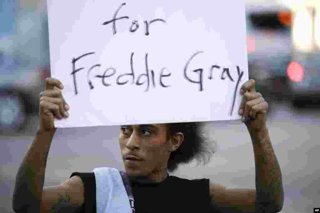 Lee Martel, 27, holds a sign during a protest following the funeral of Freddie Gray, who died from spinal injuries while in police custody,&nbsp;in Los Angeles, April 28, 2015.