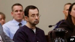 FILE - Larry Nassar sits during his sentencing hearing in Lansing, Michigan, Jan. 24, 2018.