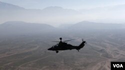 A German Bundeswehr armed forces Tiger attack helicopter flies next to the Marmal mountain near Camp Marmal in Mazar-e-Sharif, northern Afghanistan December 20, 2012. REUTERS/Fabrizio Bensch (AFGHANISTAN - Tags: MILITARY CONFLICT POLITICS)